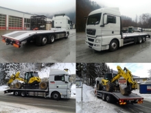 MAN TGX 26.440 mit Plateauaufbau mit Heckanschrägung für Baggertransporte.