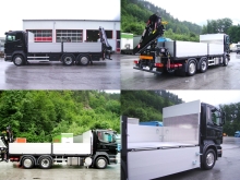 SCANIA mit Bauwarenpritsche und Heckkran.