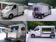MB Sprinter mit Abschlepp-Hubbrille am Heck. Kofferaufbau mit seitlichen Rolltoren und Fenster-Einbauten. MB Sprinter mit Abschlepp-Hubbrille am Heck. Kofferaufbau mit seitlichen Rolltoren und Fenster-Einbauten.
